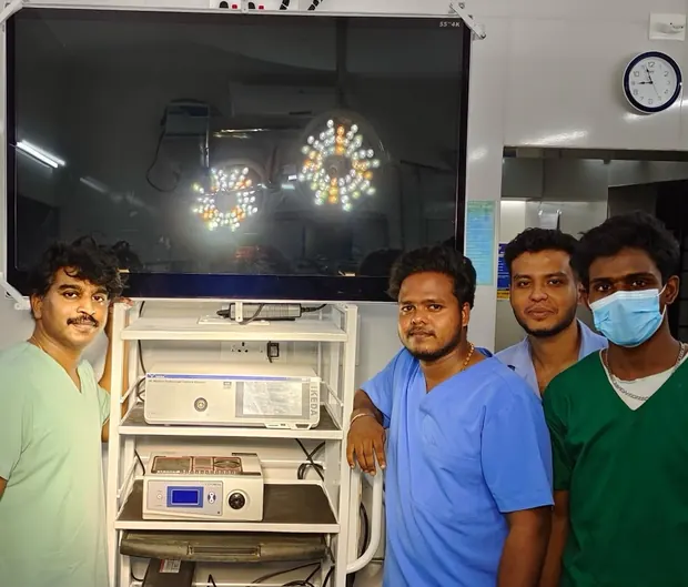 Surgical team at Pratheep Nursing Home beside the 4K laparoscopic camera tower